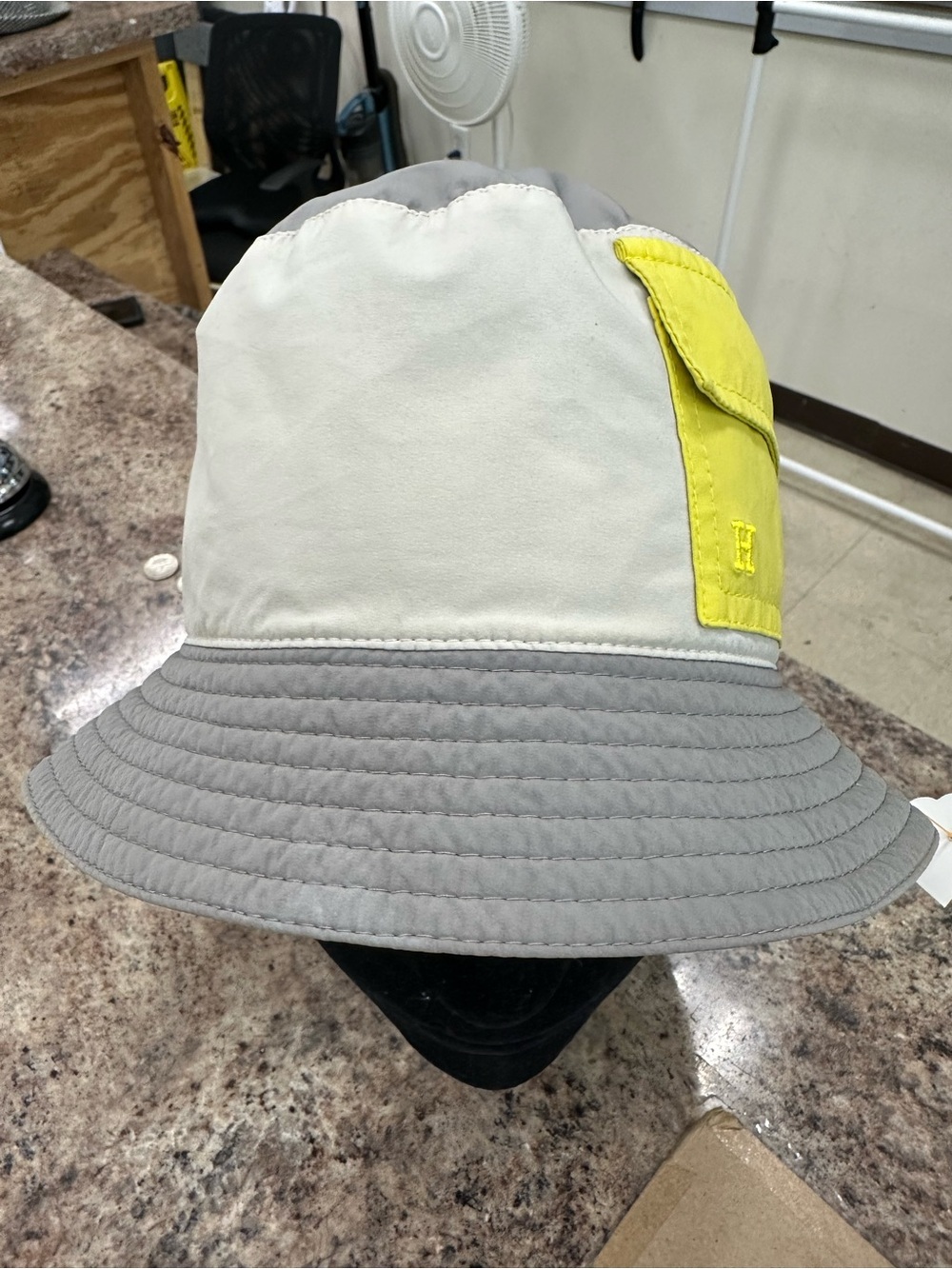 Hermes Cream and Gray Bucket Hat with Yellow Pocket Accent with golf tee holder.